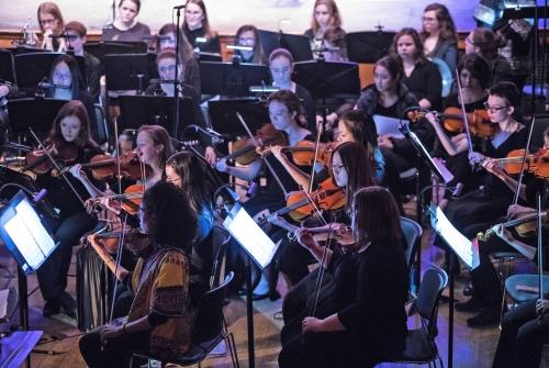 Students performing with the Mount Holyoke Symphony Orchestra